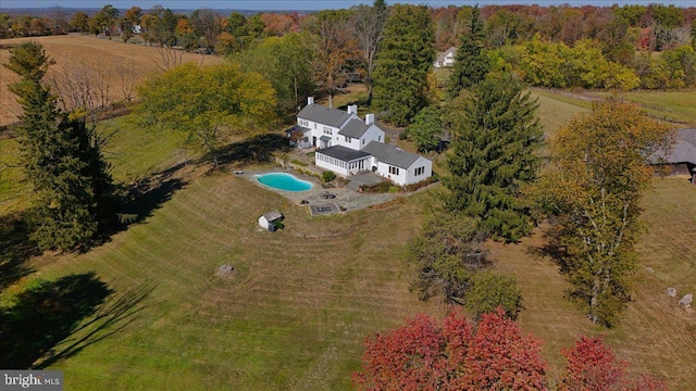 birds eye view of property with a rural view