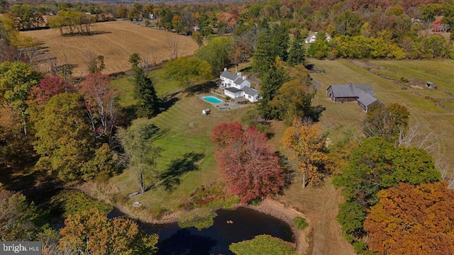 birds eye view of property with a rural view