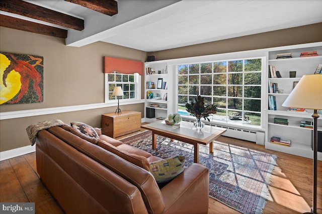 living room featuring beamed ceiling, dark wood-type flooring, and a baseboard radiator