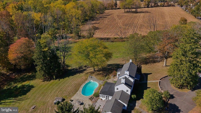 birds eye view of property with a rural view