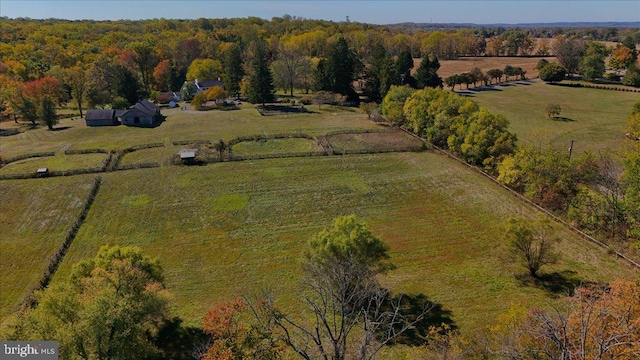 birds eye view of property with a rural view