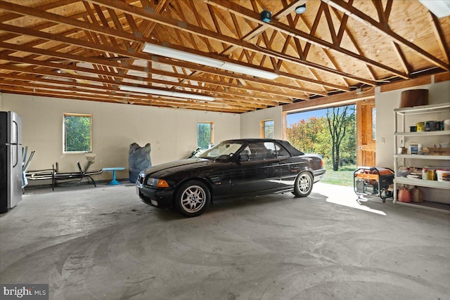 garage with stainless steel fridge