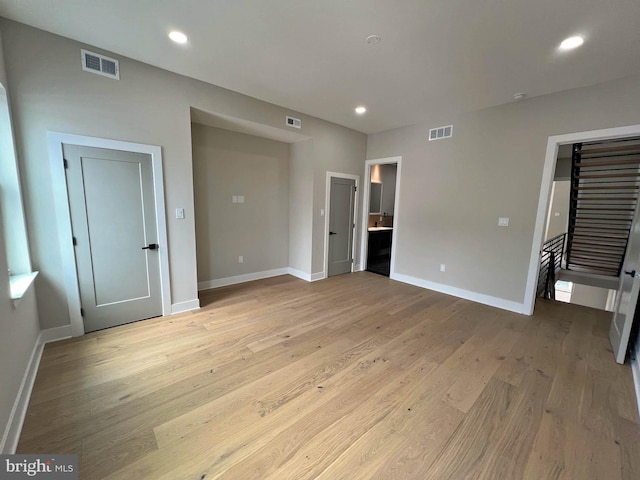 unfurnished bedroom featuring light wood-type flooring