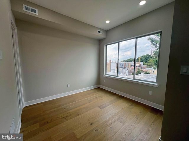 spare room featuring light hardwood / wood-style flooring