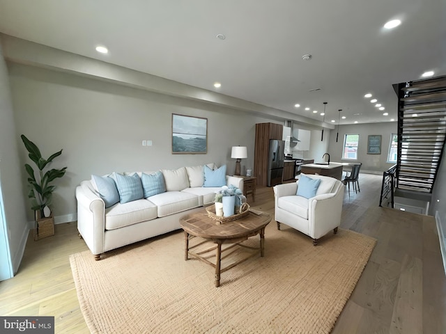 living room with light hardwood / wood-style floors