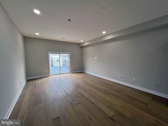 unfurnished room with dark hardwood / wood-style floors