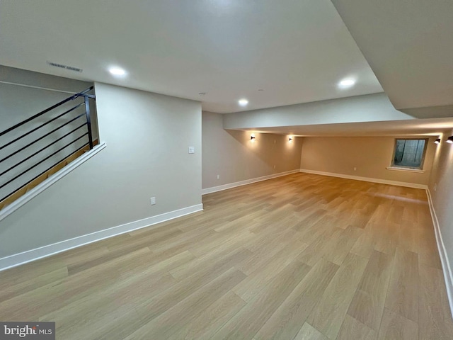 basement featuring light wood-type flooring