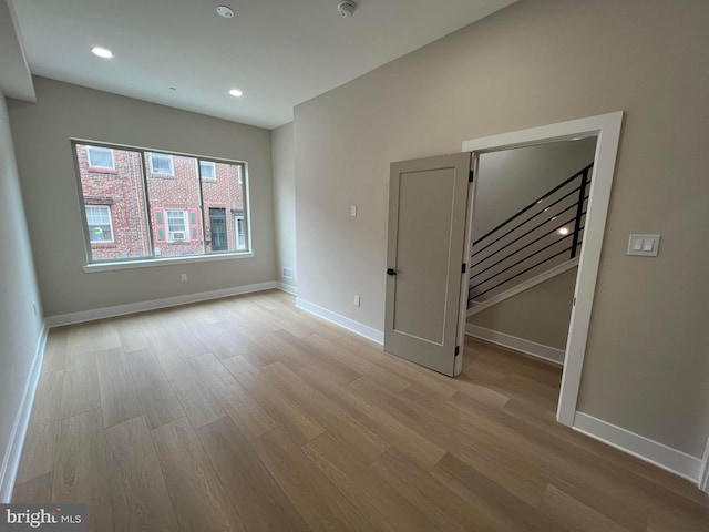 spare room featuring light hardwood / wood-style flooring