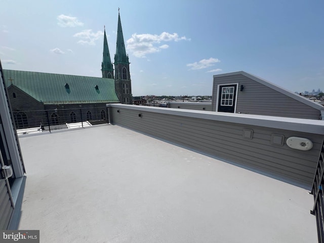 view of patio featuring a balcony