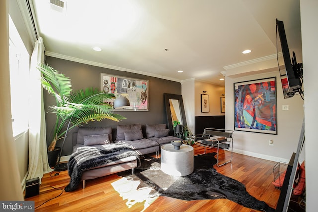 living room featuring ornamental molding and hardwood / wood-style flooring