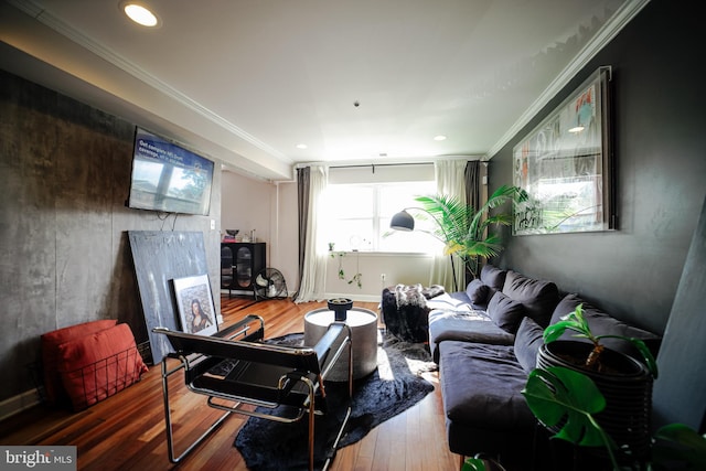 living room featuring crown molding and wood-type flooring