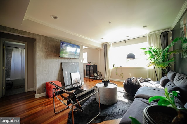 living room with ornamental molding, hardwood / wood-style floors, and a wealth of natural light