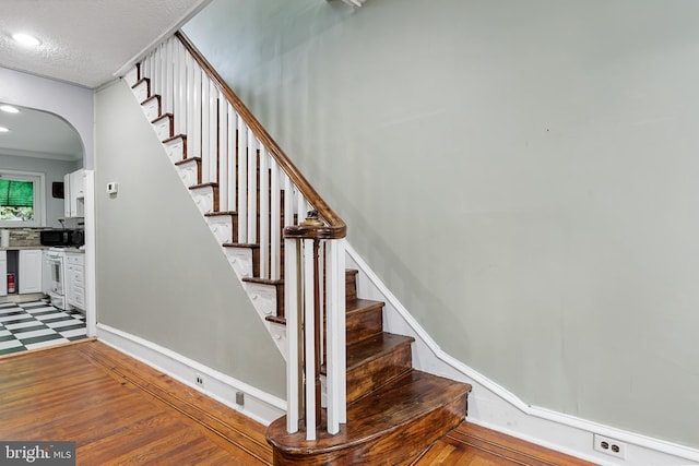 staircase with crown molding