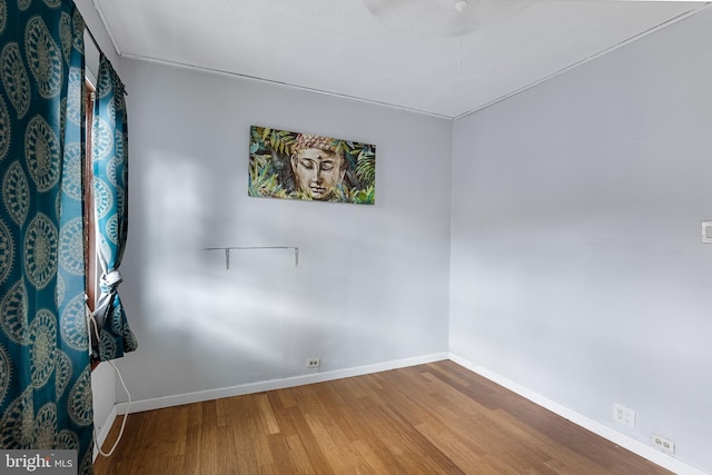 empty room with wood-type flooring