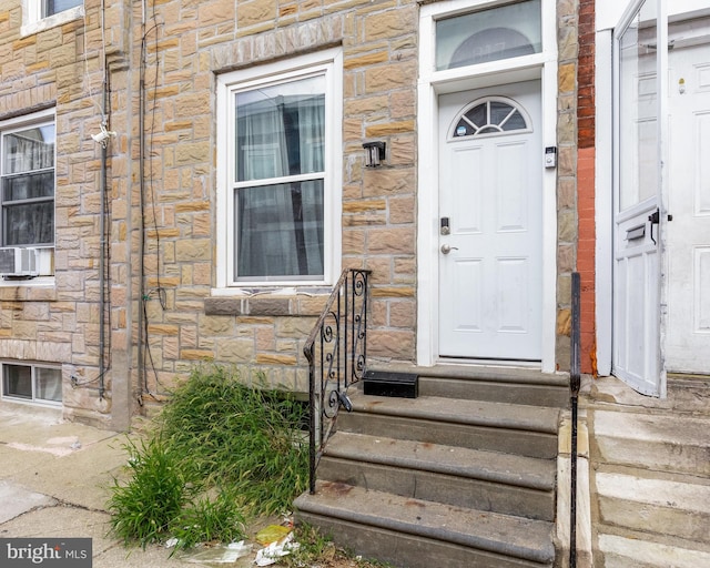 doorway to property with cooling unit