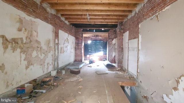 miscellaneous room featuring beam ceiling