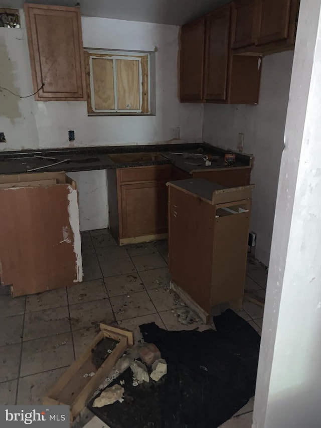 kitchen featuring sink and light tile patterned floors