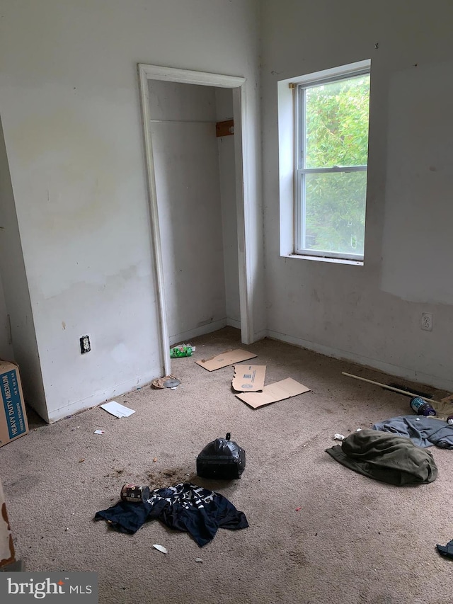 unfurnished bedroom with carpet