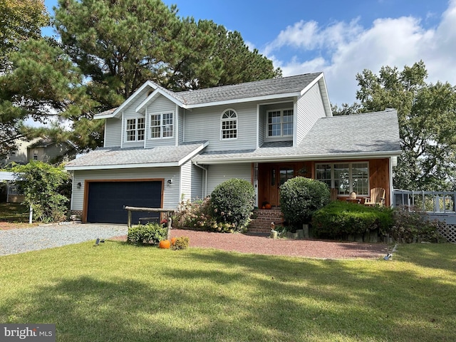 view of front facade with a garage and a front lawn