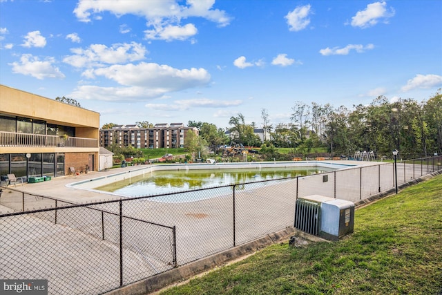 view of pool with a water view