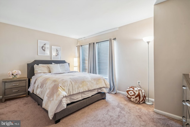 bedroom with light colored carpet