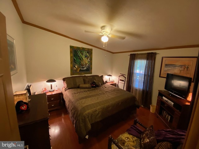 bedroom featuring ceiling fan, crown molding, and dark wood-type flooring