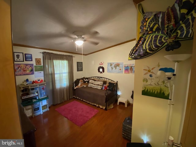 bedroom with ceiling fan, hardwood / wood-style flooring, and crown molding