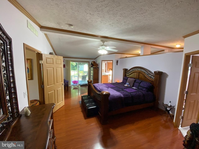 bedroom with a textured ceiling, crown molding, ceiling fan, vaulted ceiling with beams, and hardwood / wood-style floors