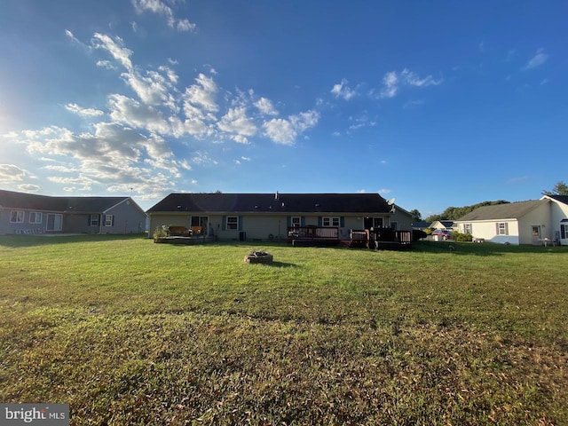 rear view of house with a yard