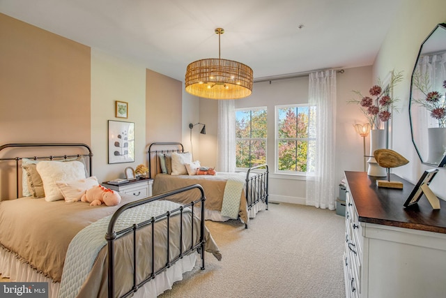 bedroom featuring light colored carpet