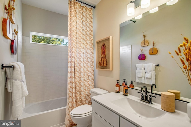 full bathroom featuring vanity, toilet, and shower / tub combo