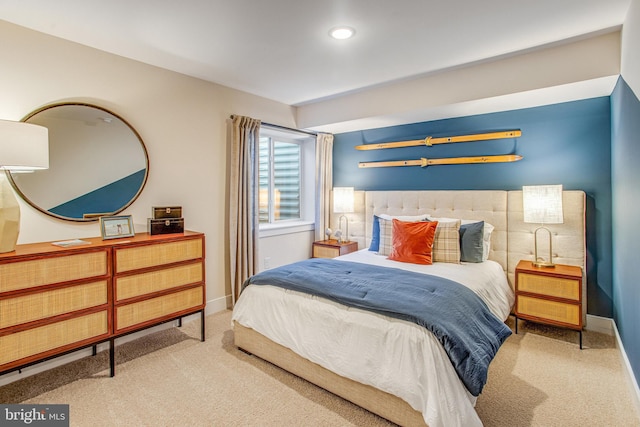 bedroom featuring light carpet