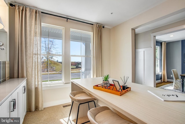 view of carpeted dining area