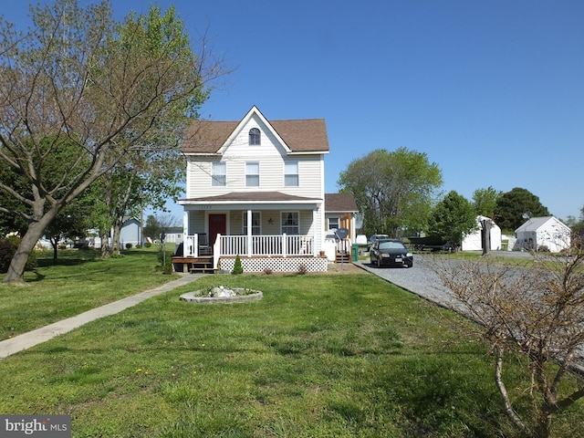 2826 Hoopers Island Rd, Church Creek, MD 21622 - view of front facade with a porch, a front lawn, and roof with shingles