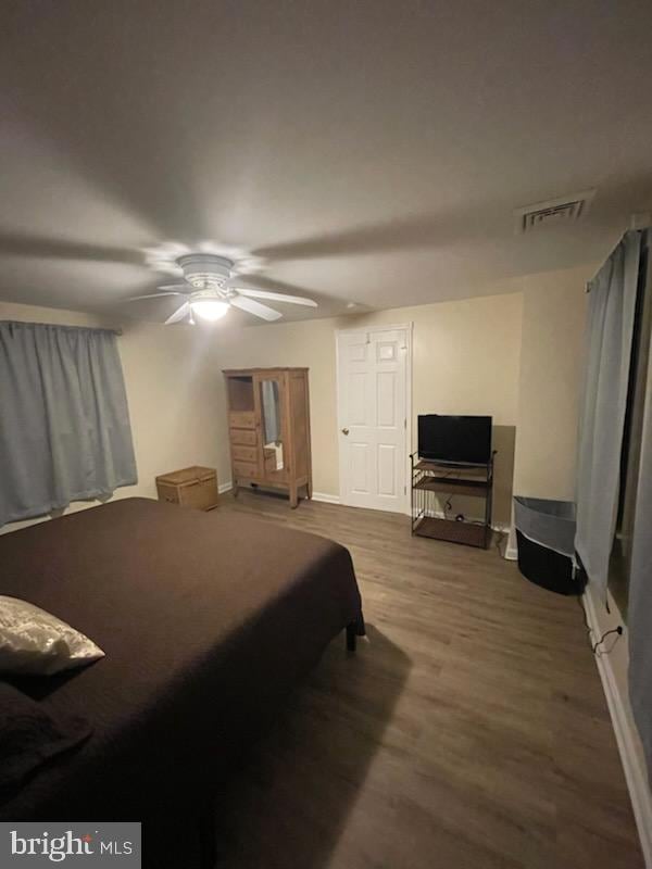 bedroom featuring hardwood / wood-style flooring and ceiling fan