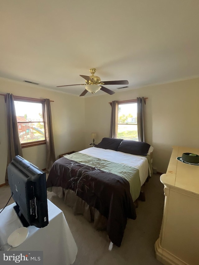 bedroom with ceiling fan and carpet flooring