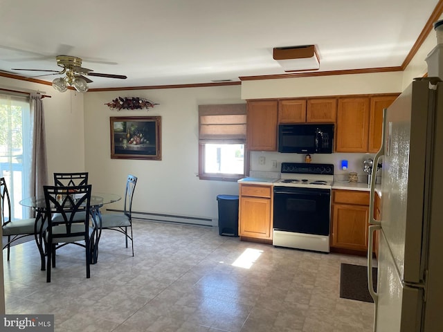 kitchen featuring a baseboard radiator, ceiling fan, plenty of natural light, and white appliances