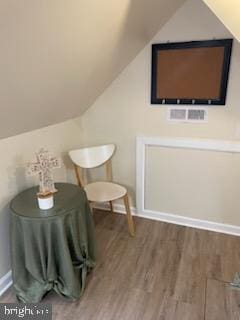 2826 Hoopers Island Rd, Church Creek, MD 21622 - sitting room featuring wood finished floors, vaulted ceiling, and baseboards
