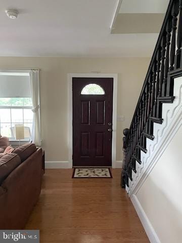 foyer entrance with hardwood / wood-style floors