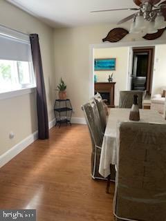 dining area featuring hardwood / wood-style floors and ceiling fan