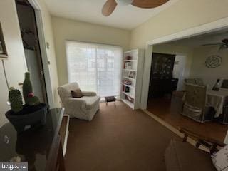 sitting room with ceiling fan