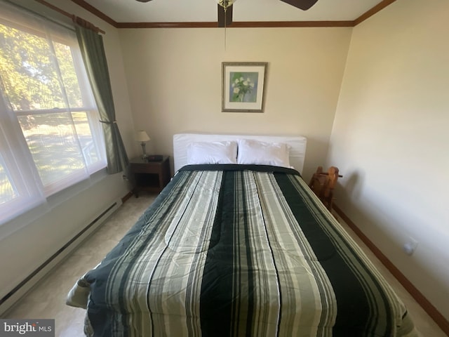 bedroom featuring crown molding, baseboard heating, and ceiling fan