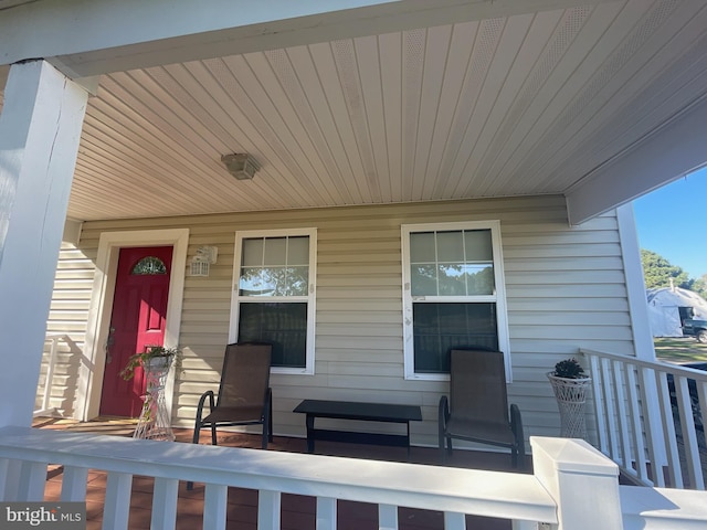 doorway to property featuring covered porch