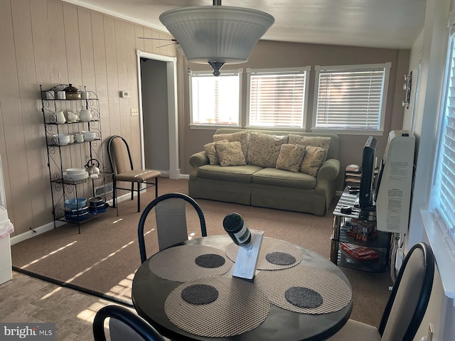 2826 Hoopers Island Rd, Church Creek, MD 21622 - dining area with vaulted ceiling, wood walls, and baseboards