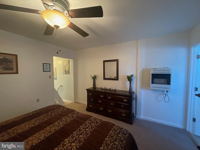 carpeted bedroom featuring heating unit and ceiling fan