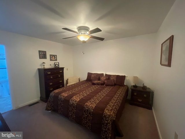 bedroom featuring dark carpet and ceiling fan