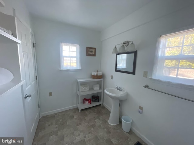 2826 Hoopers Island Rd, Church Creek, MD 21622 - bathroom featuring a sink, stone finish floor, and baseboards