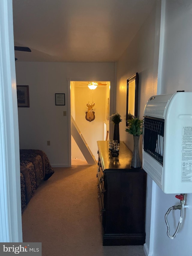 carpeted bedroom featuring heating unit