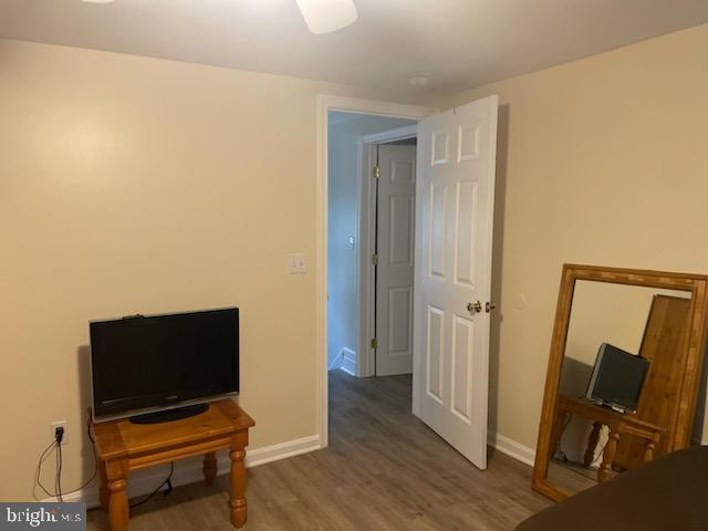 miscellaneous room with dark hardwood / wood-style floors