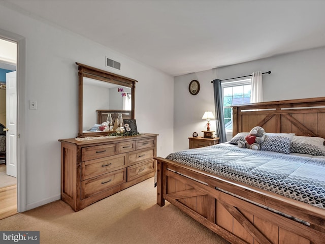 bedroom with light carpet